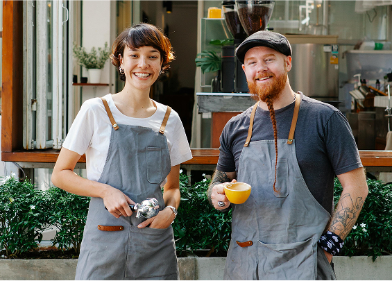 Tow happy people outside of a coffee shop
